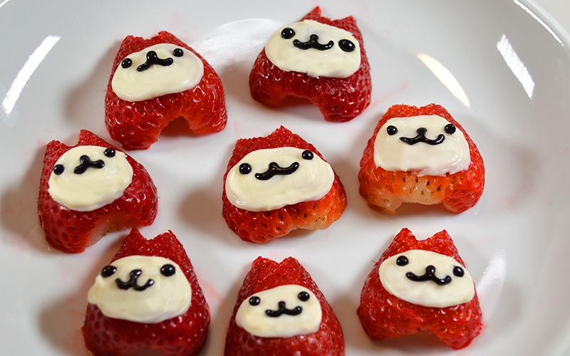 Strawberry with faces for strawberry cheesecake cup