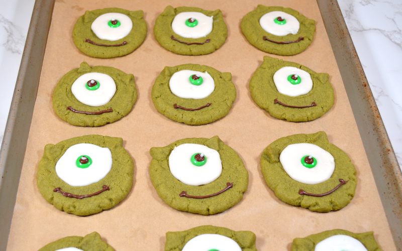 Highlights on Mike Wazowski's eye on the completed matcha thumbprint cookie